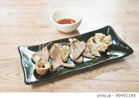 boiled entrails with chop pork on black plate dipping spicy and sour chili sauce 90401188