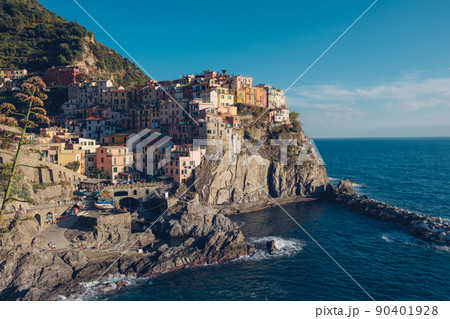 Rocky hills and colorful historic buildings of Manarola, Italy. Rocky hills and colorful historic buildings of Manarola, Italy. 90401928