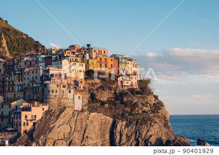 Rocky hills and colorful historic buildings of Manarola, Italy. Rocky hills and colorful historic buildings of Manarola, Italy. 90401929