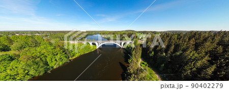 Summer panoramic aerial view of bridge and Kymijoki river waters in Finland, Kymenlaakso, Kouvola, Koria Summer panoramic aerial view of bridge and Kymijoki river waters in Finland, Kymenlaakso, Kouvola, Koria 90402279