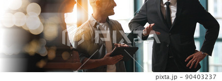Businesspeople working together, CEO in front view discussing concept of analysts trying to predict stock market behavior. Double exposure Businesspeople working together, CEO in front view discussing concept of analysts trying to predict stock market behavior. Double exposure 90403237