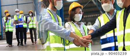 Team of business people, worker  Foreman, engineer wear face masks to prevent covid-19 in shipping yard. Concept of transportation, logistics. Selective focused 90403239