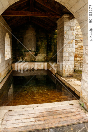 Holy spring in Lyadovsky rocky monastery, Ukraine 90403277