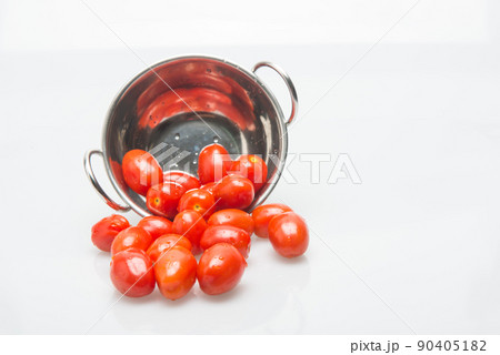 small and tasty tomatoes on a white background 90405182