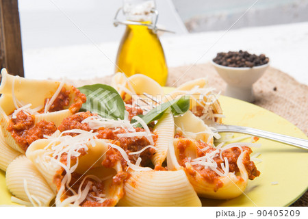 shell type pasta dish with meat served on table shell type pasta dish with meat served on table 90405209