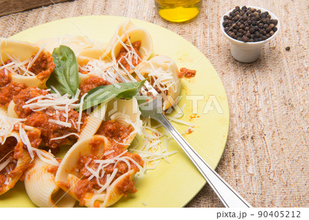 shell type pasta dish with meat served on table shell type pasta dish with meat served on table 90405212