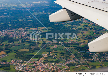 Plain wing over Belgium. Flight from Amsterdam to Brussels. 90406445