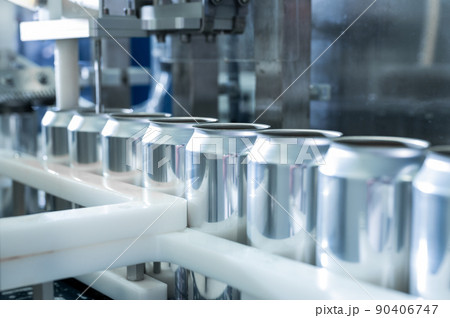 Empty new aluminum cans for drink process in factory line on conveyor belt machine at beverage 90406747