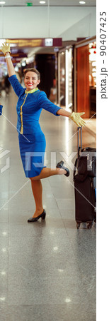 Cheerful women stewardesses having fun in airport terminal 90407425