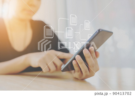 Woman using mobile smartphone. Document management system (DMS) Woman using mobile smartphone. Document management system (DMS) 90413702
