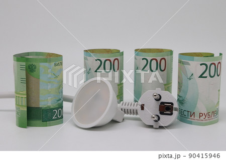 White electric cable and banknotes, expensive electricity, saving electricity. White electric cable and banknotes, expensive electricity, saving electricity. 90415946