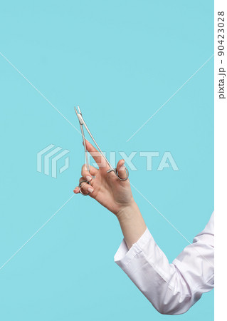 Surgical instrument in doctor hand Surgical instrument in doctor hand 90423028