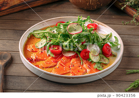 Plate of gourmet salmon carpaccio salad 90423356