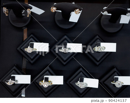 Diamond rings in jewelry luxury store window display 90424137