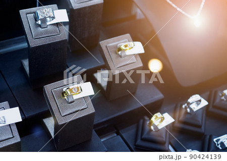 Diamond rings in jewelry luxury store window display 90424139