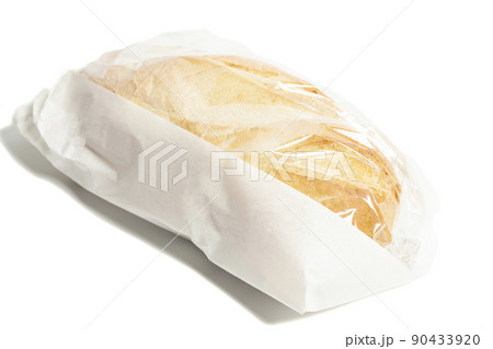 White bread in a paper bag isolated on white background White bread in a paper bag isolated on white background 90433920