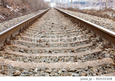 Concrete sleepers are attached with metal bolts to parallel railroad tracks. Concrete sleepers are attached with metal bolts to parallel railroad tracks. 90434308