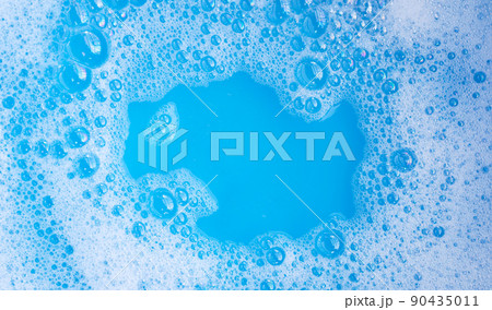 Detergent foam bubble, blue background. 90435011