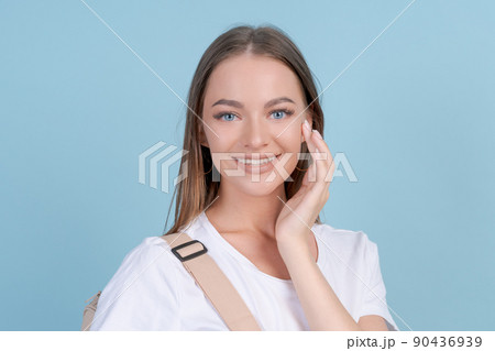 Positive college student girl holding backpack on her back Demonstrating Positive college student girl holding backpack on her back Demonstrating 90436939