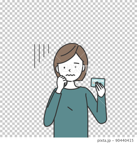 A woman with a troubled face holding a credit card A woman with a troubled face holding a credit card 90440415