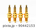 Golden spark plugs on white  background. 3d illustration. Car Repair Parts 90442153