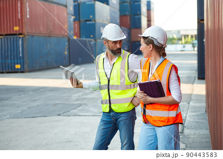 Male and female manager discuss and checking about their job for shipment to customer. Distribution storage commerce port cargo. Male and female manager discuss and checking about their job for shipment to customer. Distribution storage commerce port cargo. 90443583