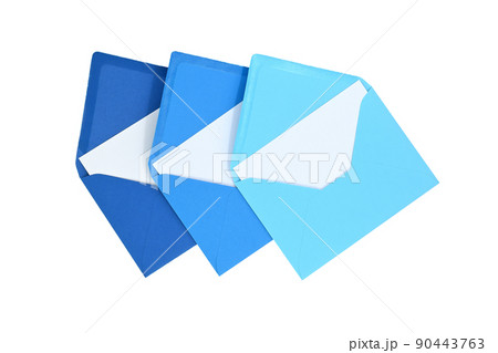 Envelopes of blue hues with blank white card 90443763