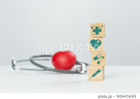 Concept of medical and healthcare. stack wooden cube blocks stacking with medical icons. Concept of medical and healthcare. stack wooden cube blocks stacking with medical icons. 90445693