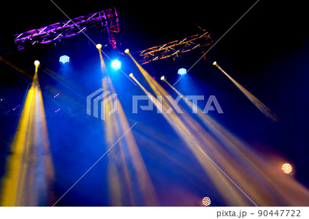 Crowd at concert - Cheering crowd in bright colorful stage lights 90447722