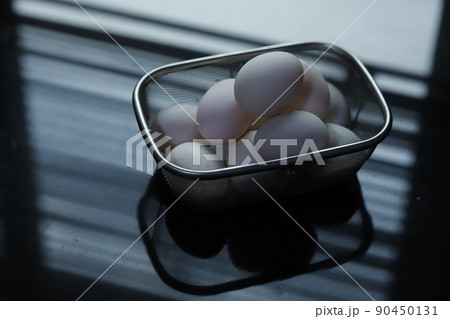 raw duck eggs in a basket 90450131