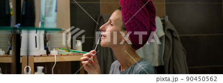 Young woman taking nasal sample with a cotton swab stick for coronavirus Young woman taking nasal sample with a cotton swab stick for coronavirus 90450562
