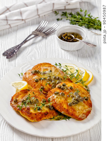 chicken piccata with lemon capers butter sauce chicken piccata with lemon capers butter sauce 90450987