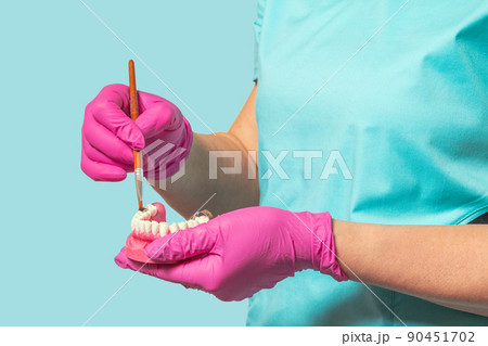 Hands with layout of the human jaw and brush. Hands with layout of the human jaw and brush. 90451702