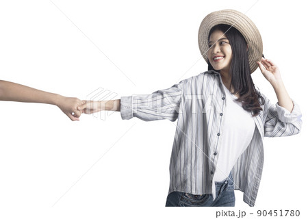Asian woman with hat holding her mate hands 90451780