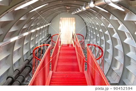Red stairs in a big tube 90452594