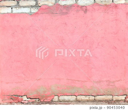 Texture of old brick wall and cracked stucco of pink color 90453040