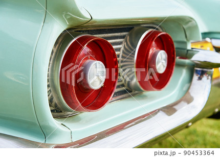 Retro car detail, Red rear light of old vintage american car Retro car detail, Red rear light of old vintage american car 90453364