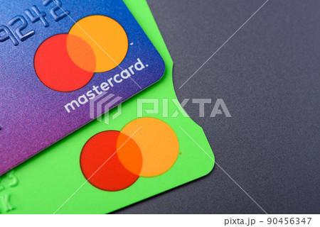 Close-up two MasterCard credit cards 90456347