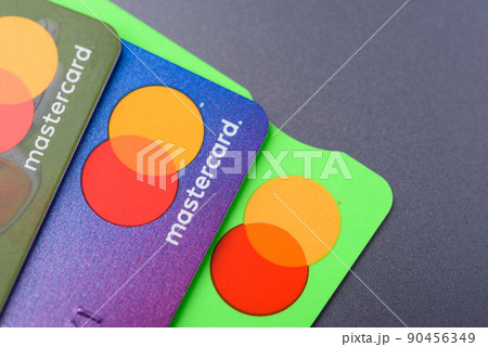 Close-up three MasterCard credit cards with new logo 90456349