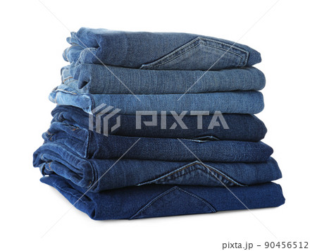 Stack of different jeans isolated on white Stack of different jeans isolated on white 90456512