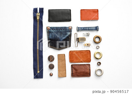 Composition with garment accessories and cutting details for jeans isolated on white, top view 90456517