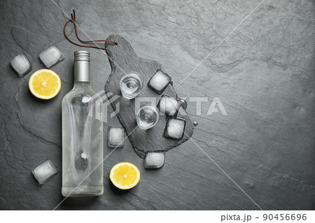 Flat lay composition with cold Russian vodka on black table. Space for text Flat lay composition with cold Russian vodka on black table. Space for text 90456696