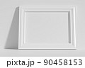 Horizontal rectangular photo frame on floor leaning at wall 90458153