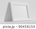 Horizontal rectangular photo frame on floor leaning at wall diagonal view 90458154