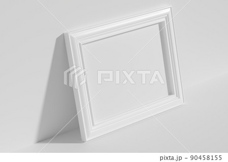 Horizontal rectangular photo frame on floor leaning at wall top diagonal view 90458155
