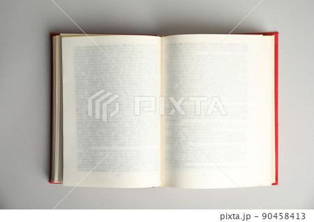 Open book on light grey background, top view. Space for text 90458413