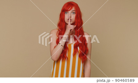Girl presses index finger to lips makes silence gesture sign do not tells secret, shh be quiet Girl presses index finger to lips makes silence gesture sign do not tells secret, shh be quiet 90460589