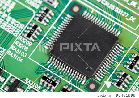 Close-up of a green computer printed circuit board with selective focus on a chip Close-up of a green computer printed circuit board with selective focus on a chip 90461999