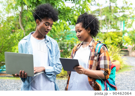 Two students in school and working on laptop 90462064