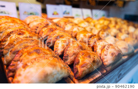 freshly baked empanadas with different fillings for sale 90462190